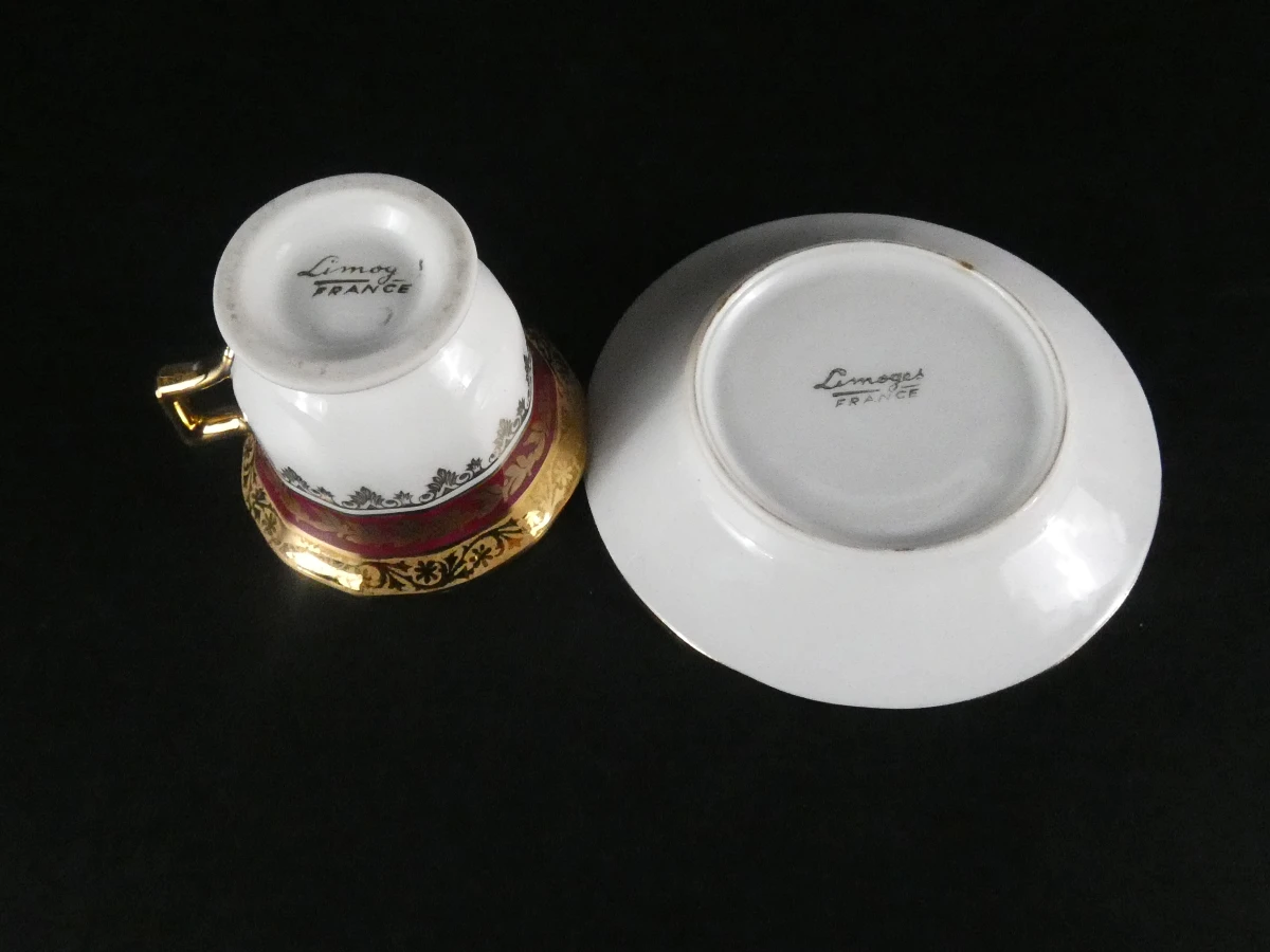 11 Limoges koffiekopjes en ondertasjes