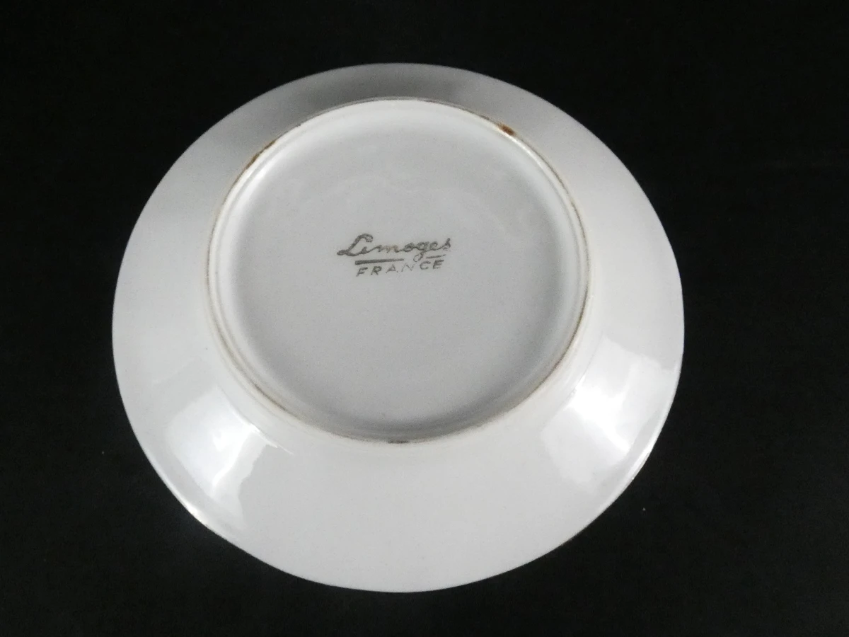 11 Limoges koffiekopjes en ondertasjes