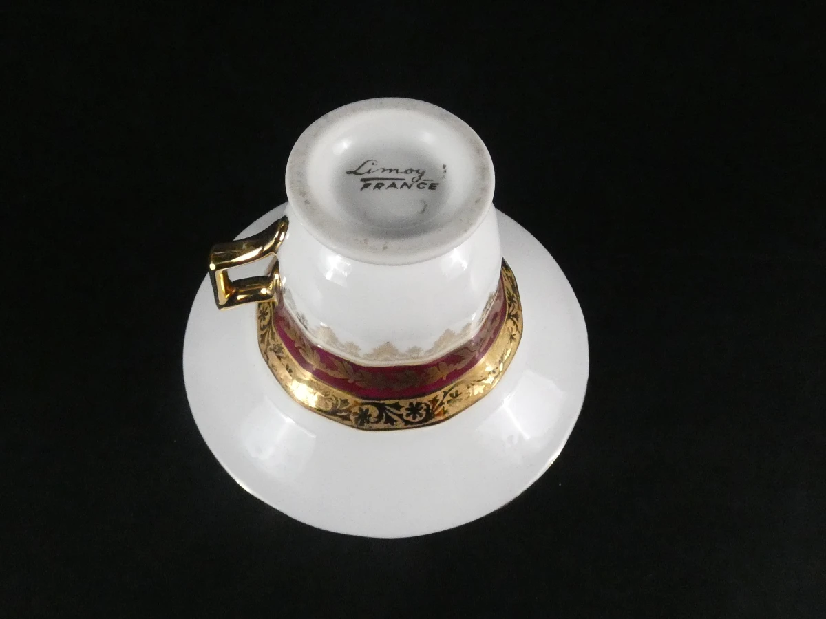 11 Limoges koffiekopjes en ondertasjes
