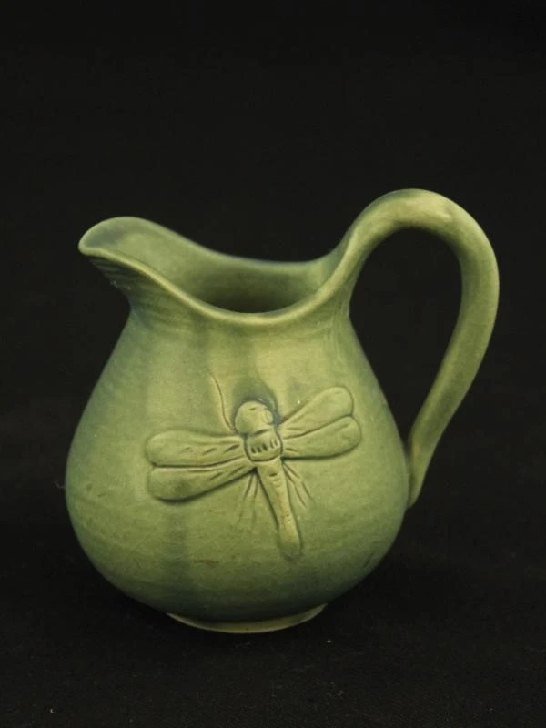Groen keramisch theeservies met dierenmotieven