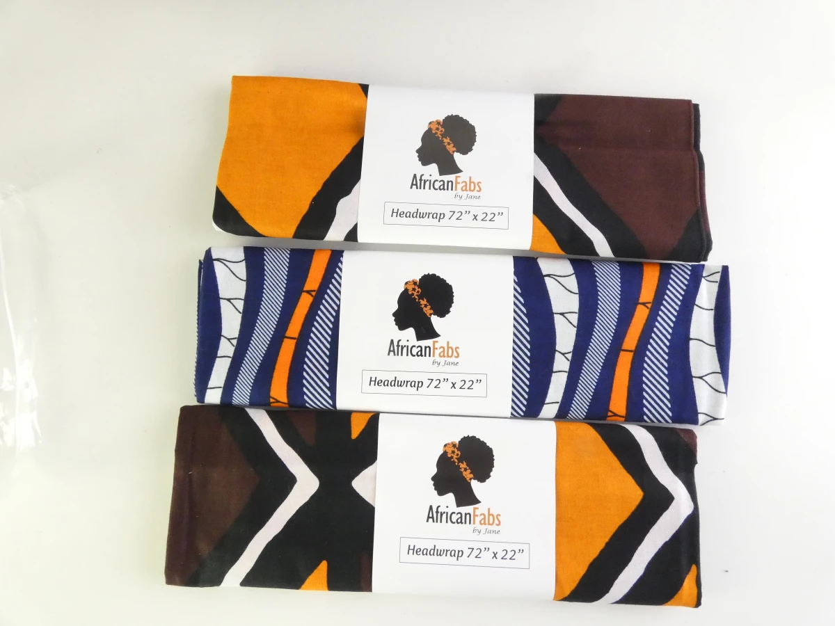 Set van kleurrijke Afrikaanse waxprints en headwraps