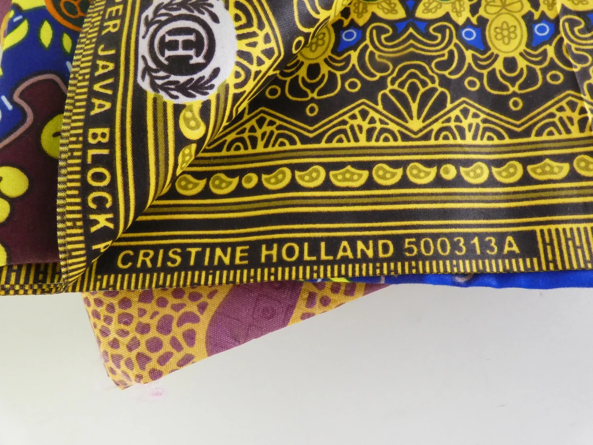 Set van kleurrijke Afrikaanse waxprints en headwraps